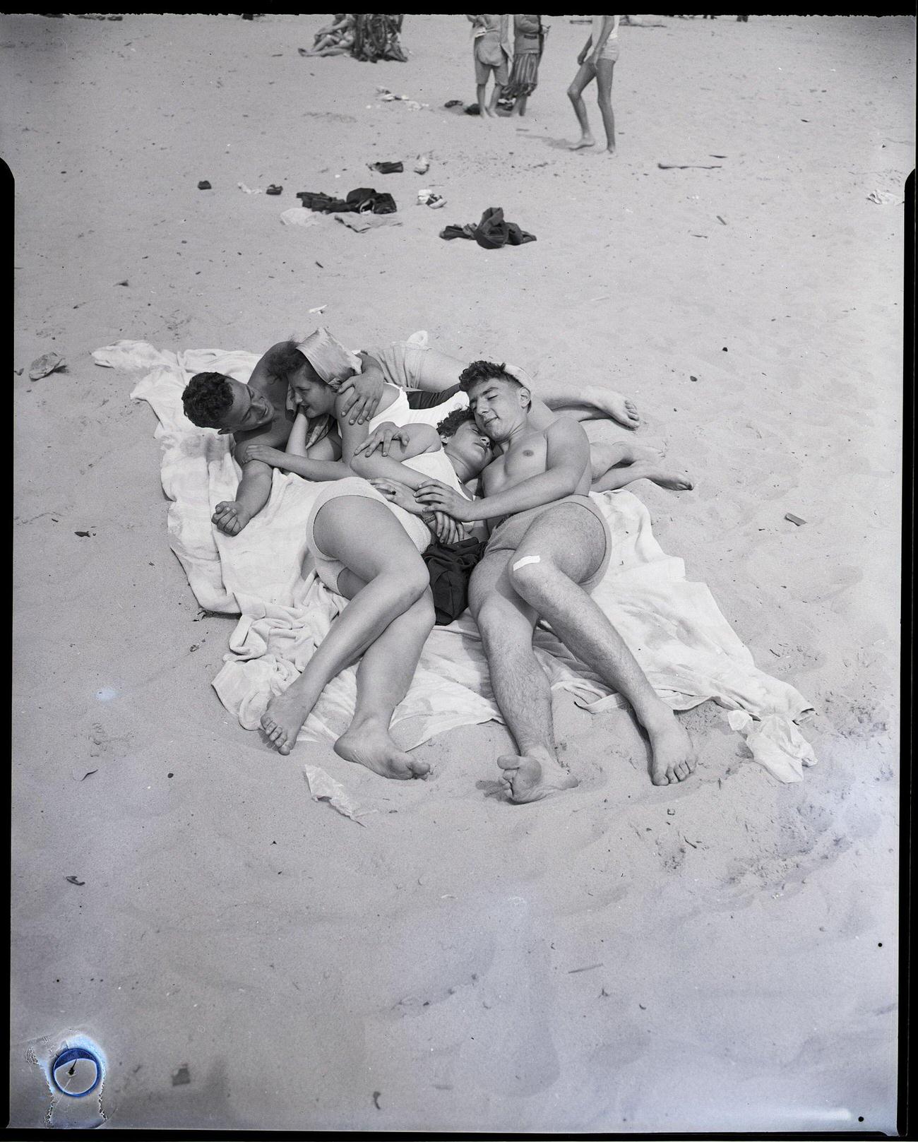 Couples Cuddle On Coney Island Beach, May 29, 1948