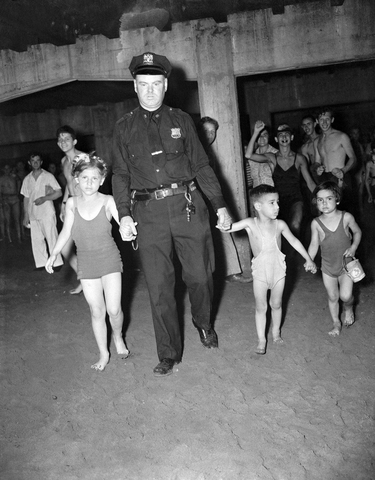 Officer Leading Three Children, July 1940