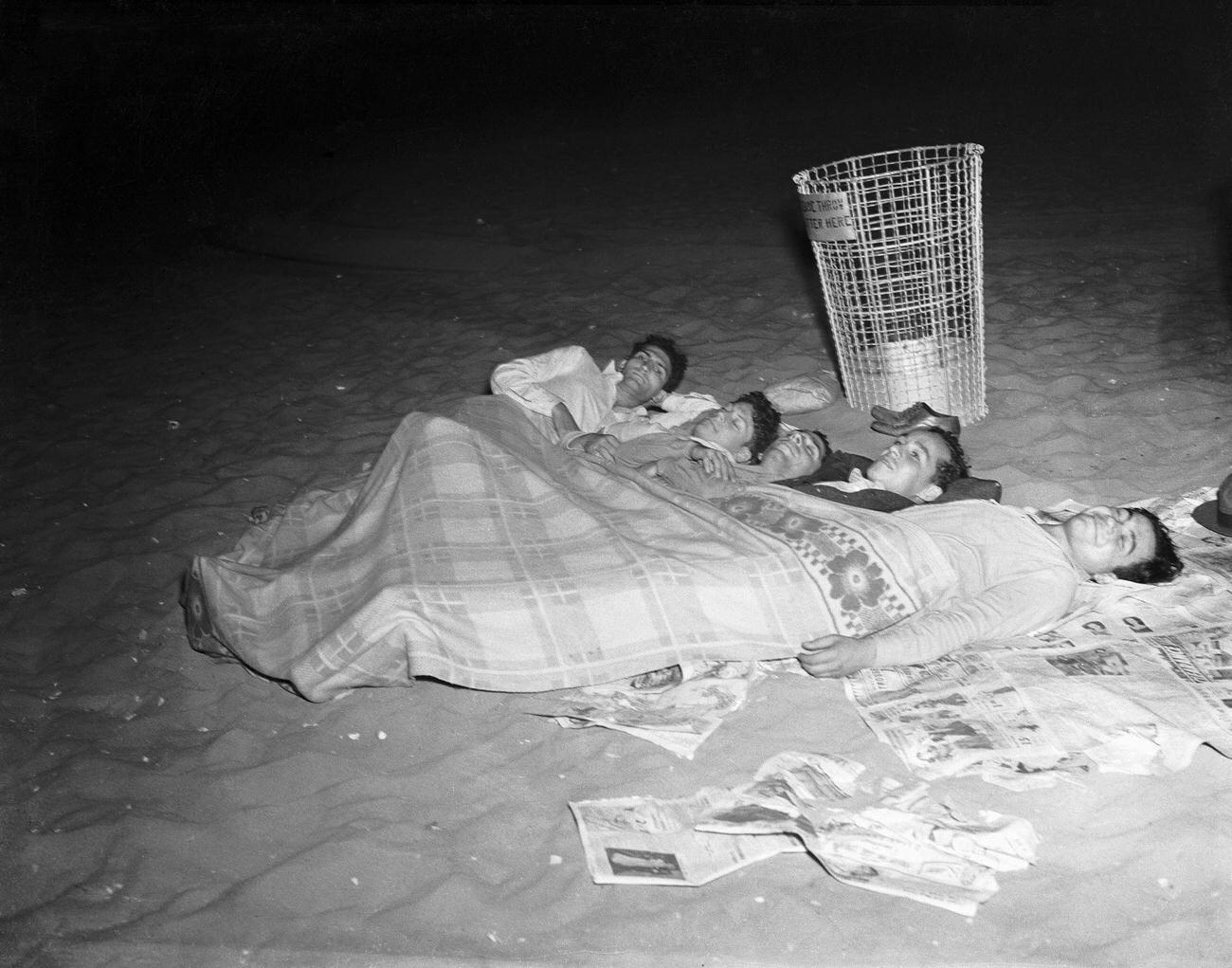 Four People Asleep On The Beach, July 1940