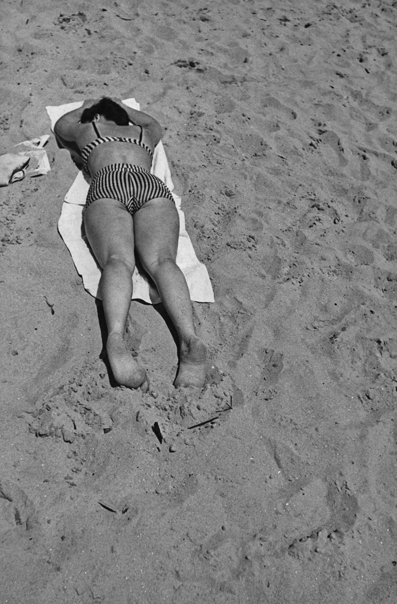 Woman Sunbathing On Coney Island Beach, 1941