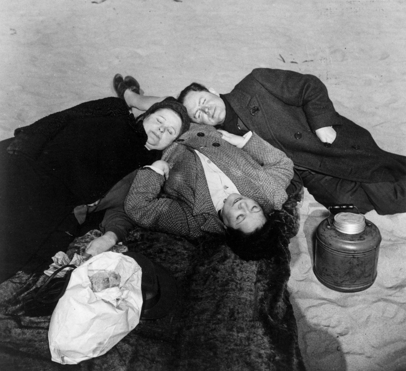 Friends Huddle On A Chilly Spring Day At The Beach, 1941