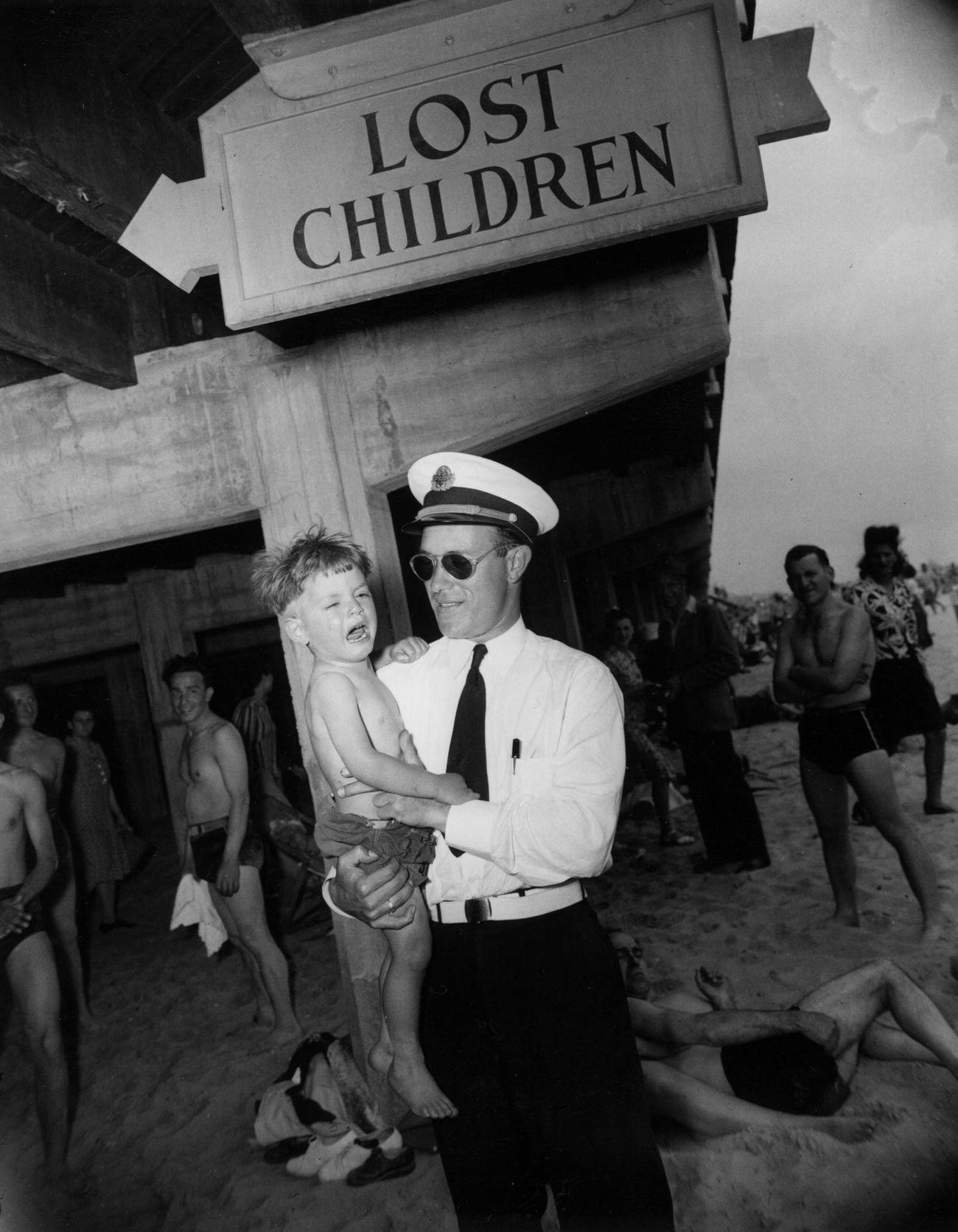 Park Attendant Holds Crying Child At Lost Children'S Office, 1941