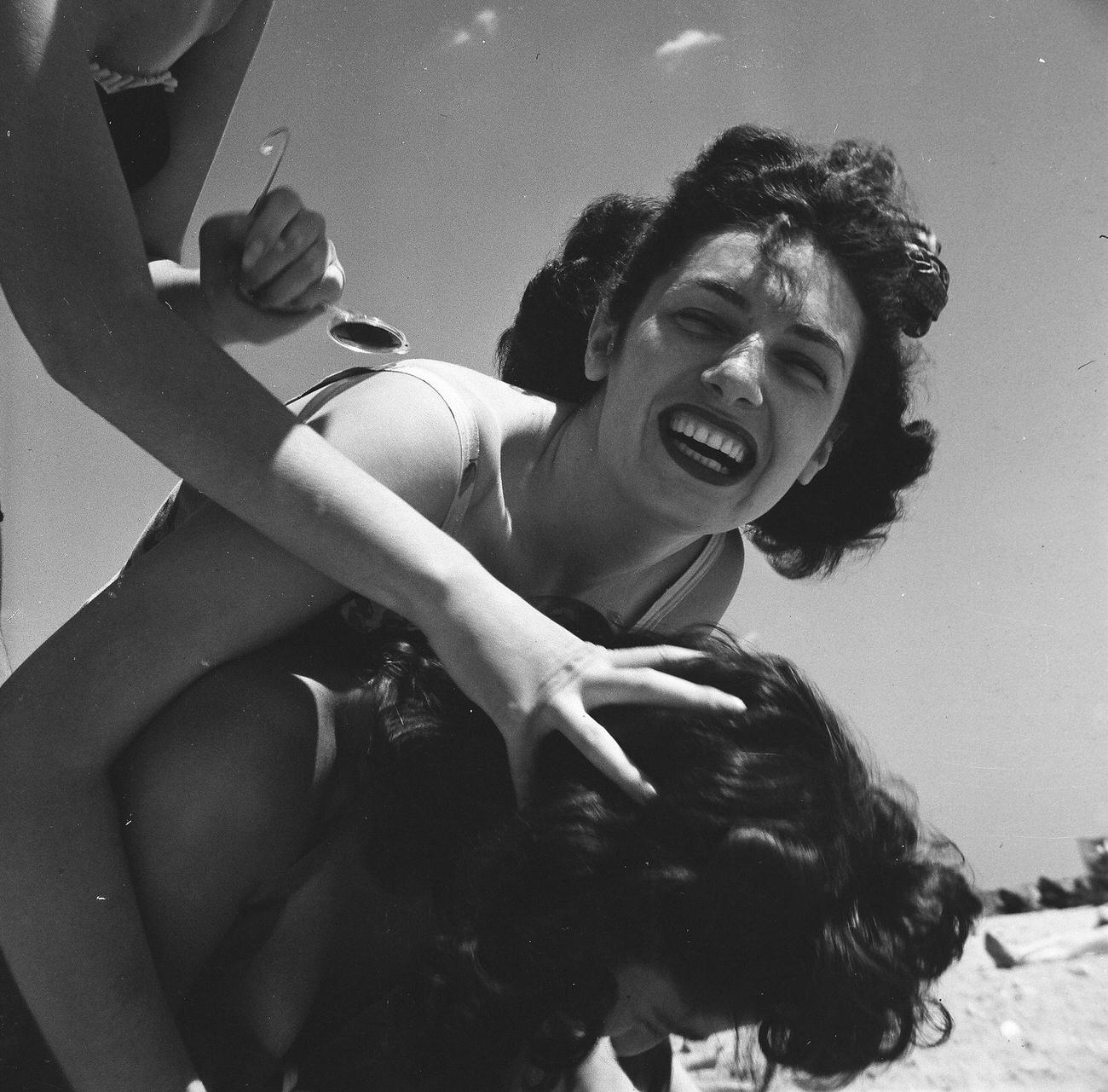 Trio Of Women Clowning Around On The Beach, 1944