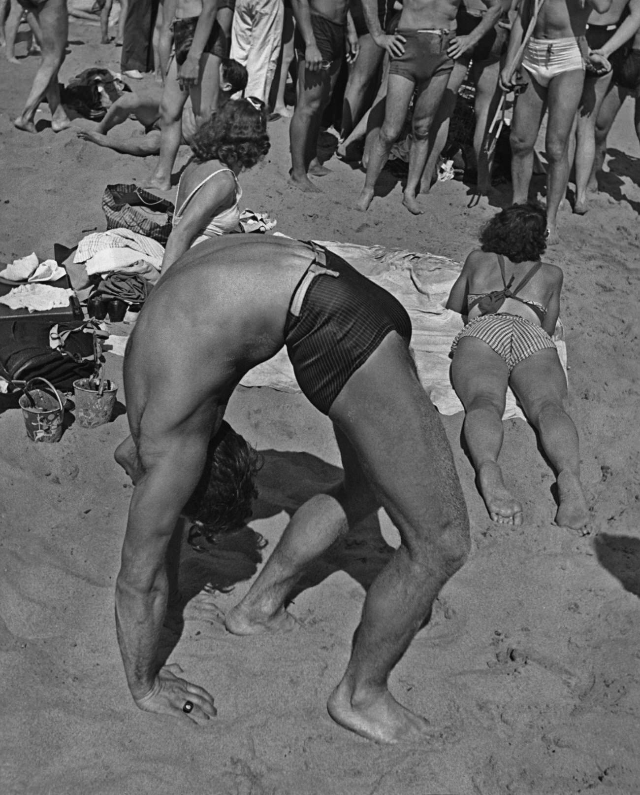 Man In Crab Position On Coney Island Beach, Circa 1940