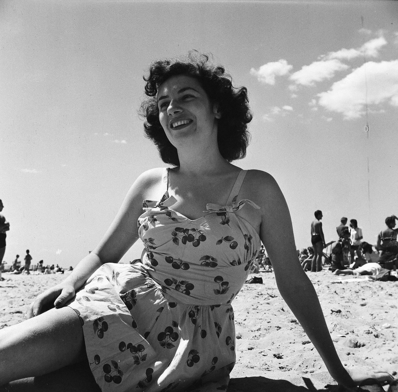 Woman Sitting On The Sand At The Beach, 1944