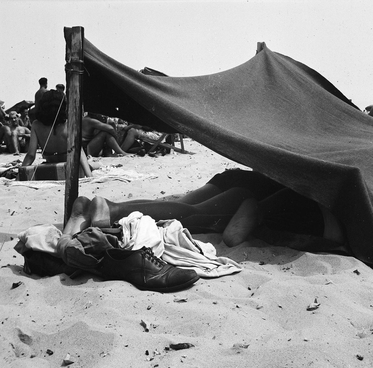 Beachgoers Lying Under Makeshift Sun Cover, 1944