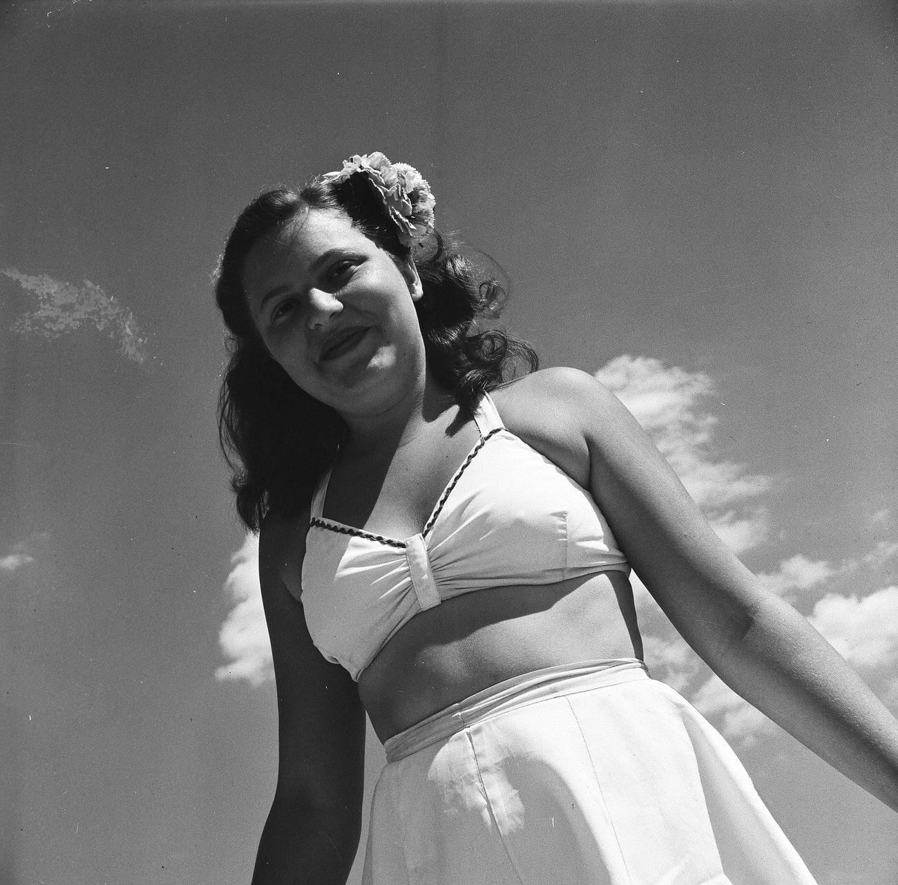 Woman Posing In Two-Piece Bathing Suit On The Beach, 1944