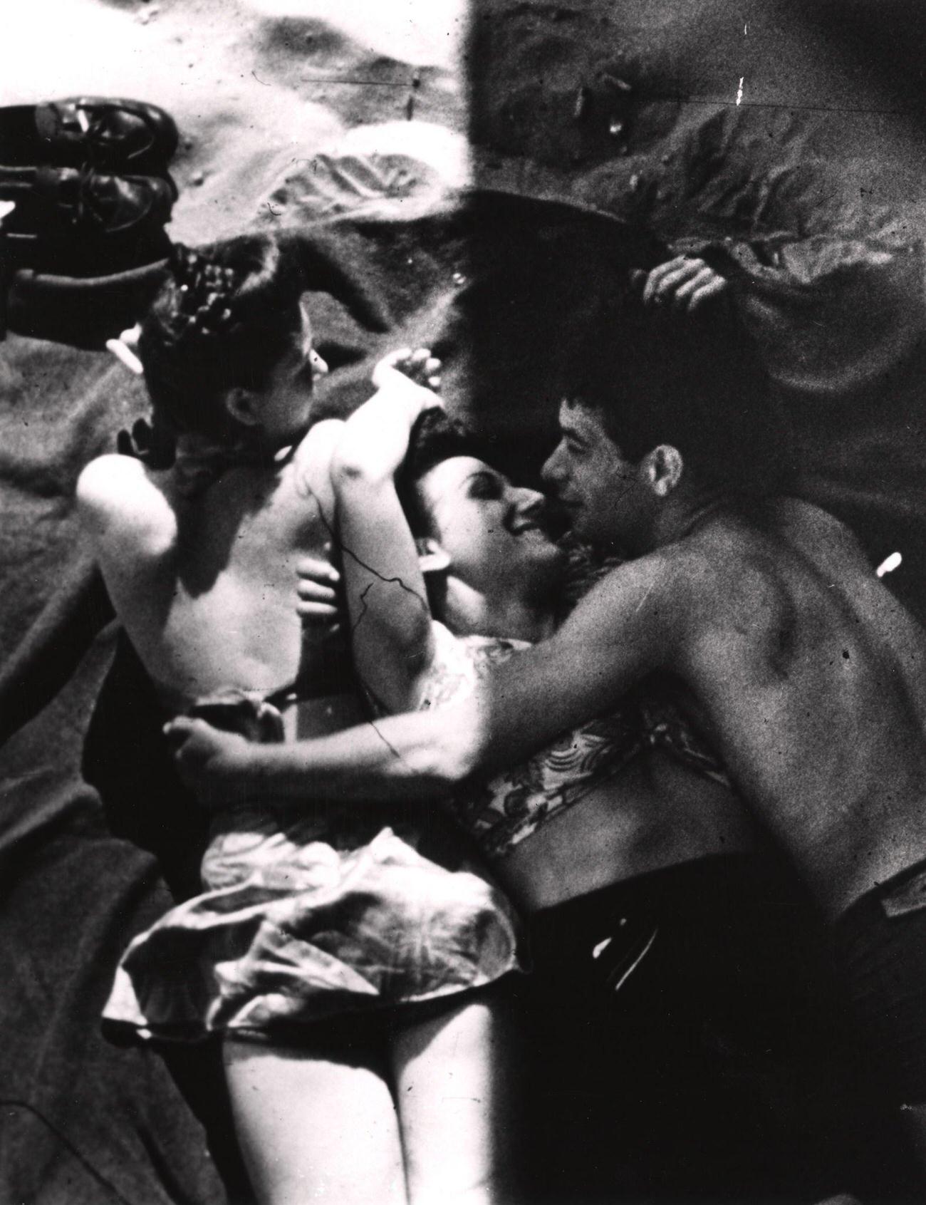 Trio Lies Entwined On Coney Island Beach, Mid 20Th Century