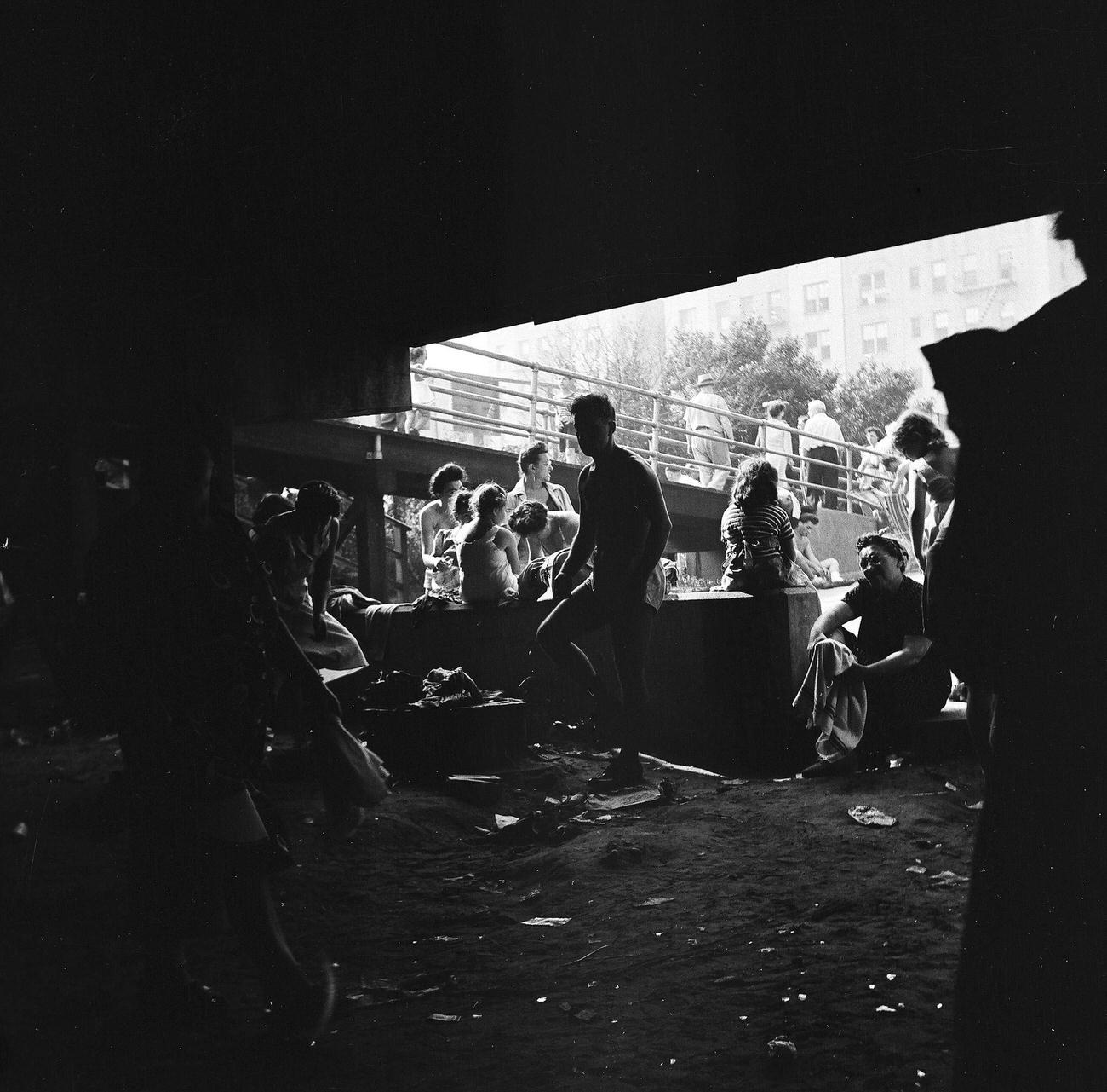 Beachgoers Under The Boardwalk, 1944