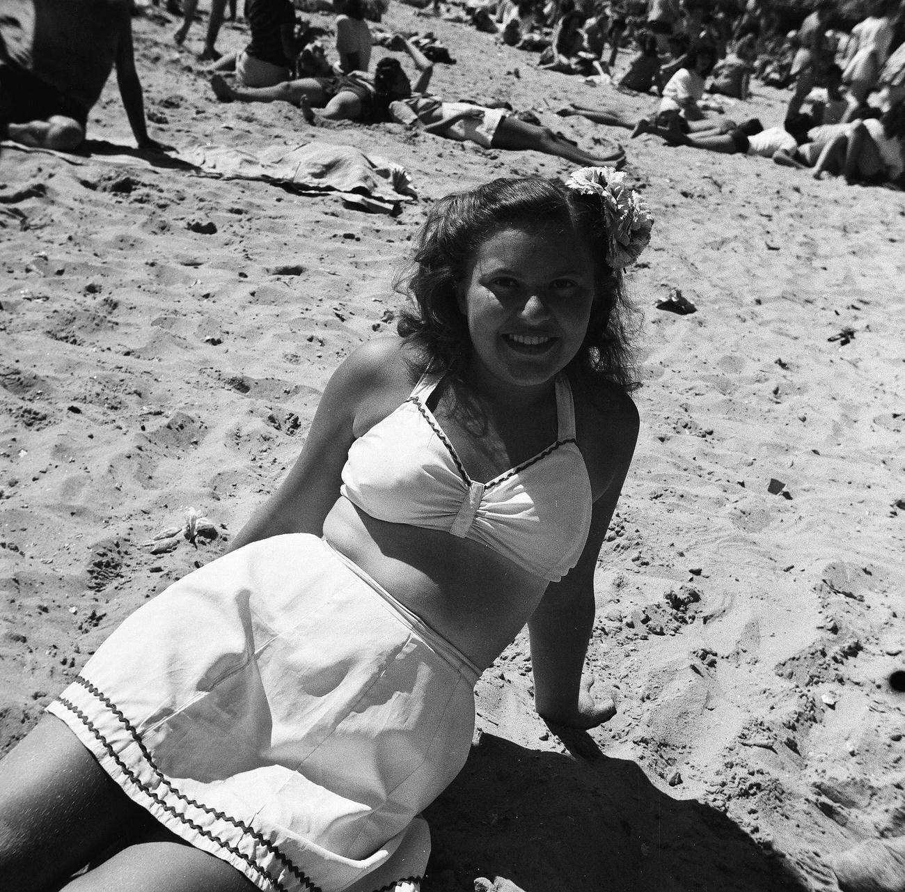 Low-Angle Portrait Of A Woman In A Two-Piece At Coney Island Beach, 1944