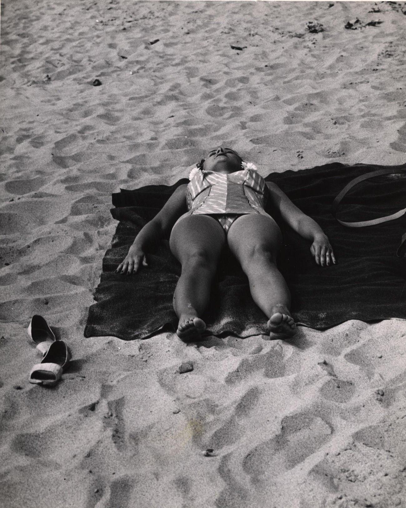 Woman Sunbathing On Coney Island Beach, Mid 20Th Century