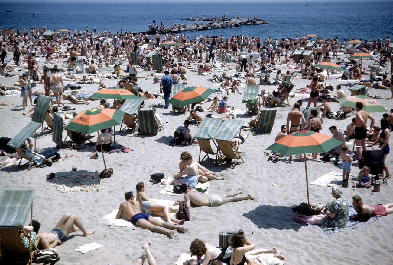 Sunbathers Soaking Up The Sun On Coney Island Beach, 1948