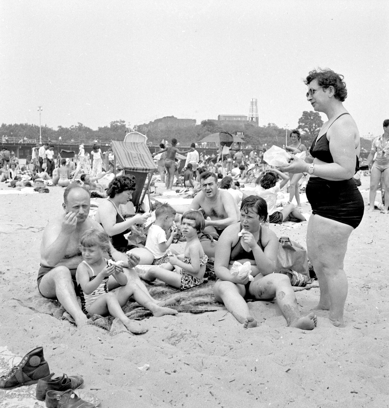 Family Enjoying Sandwiches On Coney Island Beach, July 22.