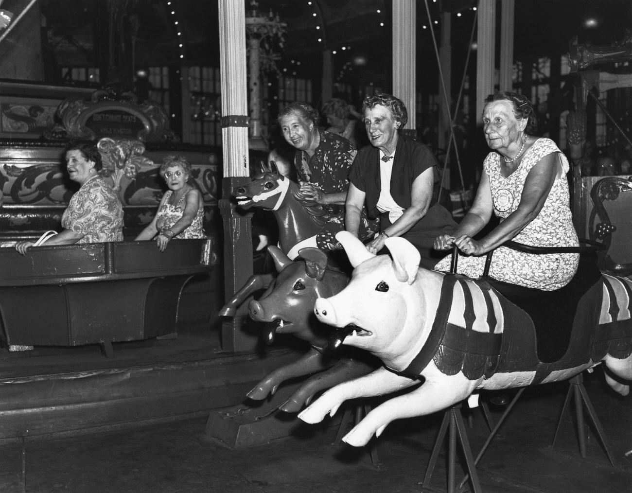 Grandmothers Ride Carousel Pigs At Steeplechase Park