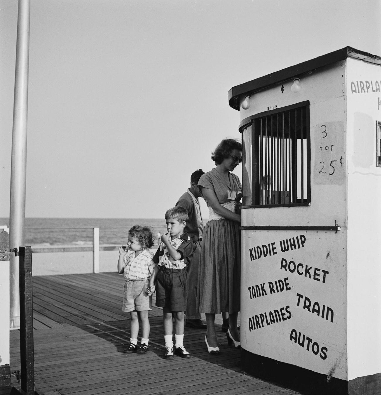 Woman Buys Fairground Ticket, Circa 1955