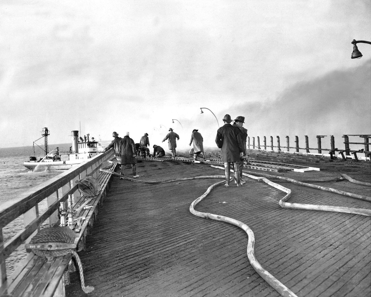 Firemen Tackle Two-Alarm Fire At Steeplechase Pier, April 1957