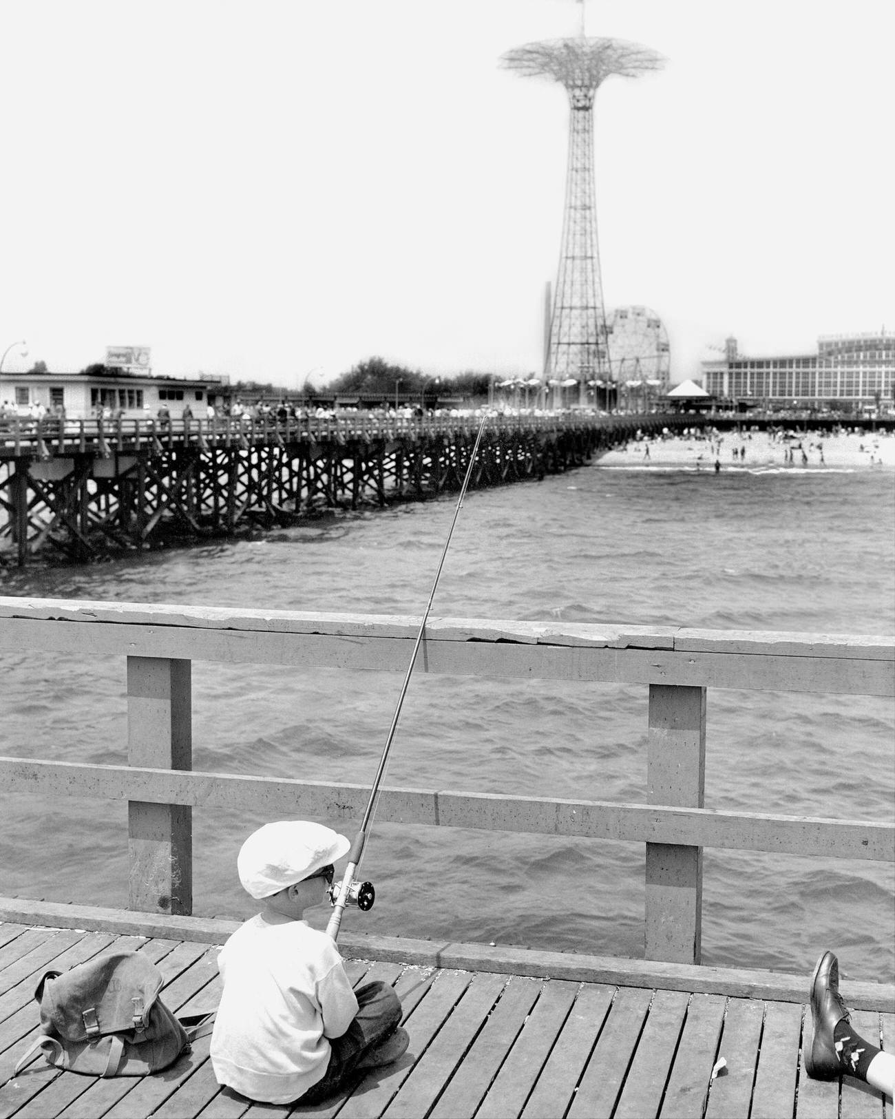 Young Fisherman Finds Solitude At Steeplechase Pier, May 1957