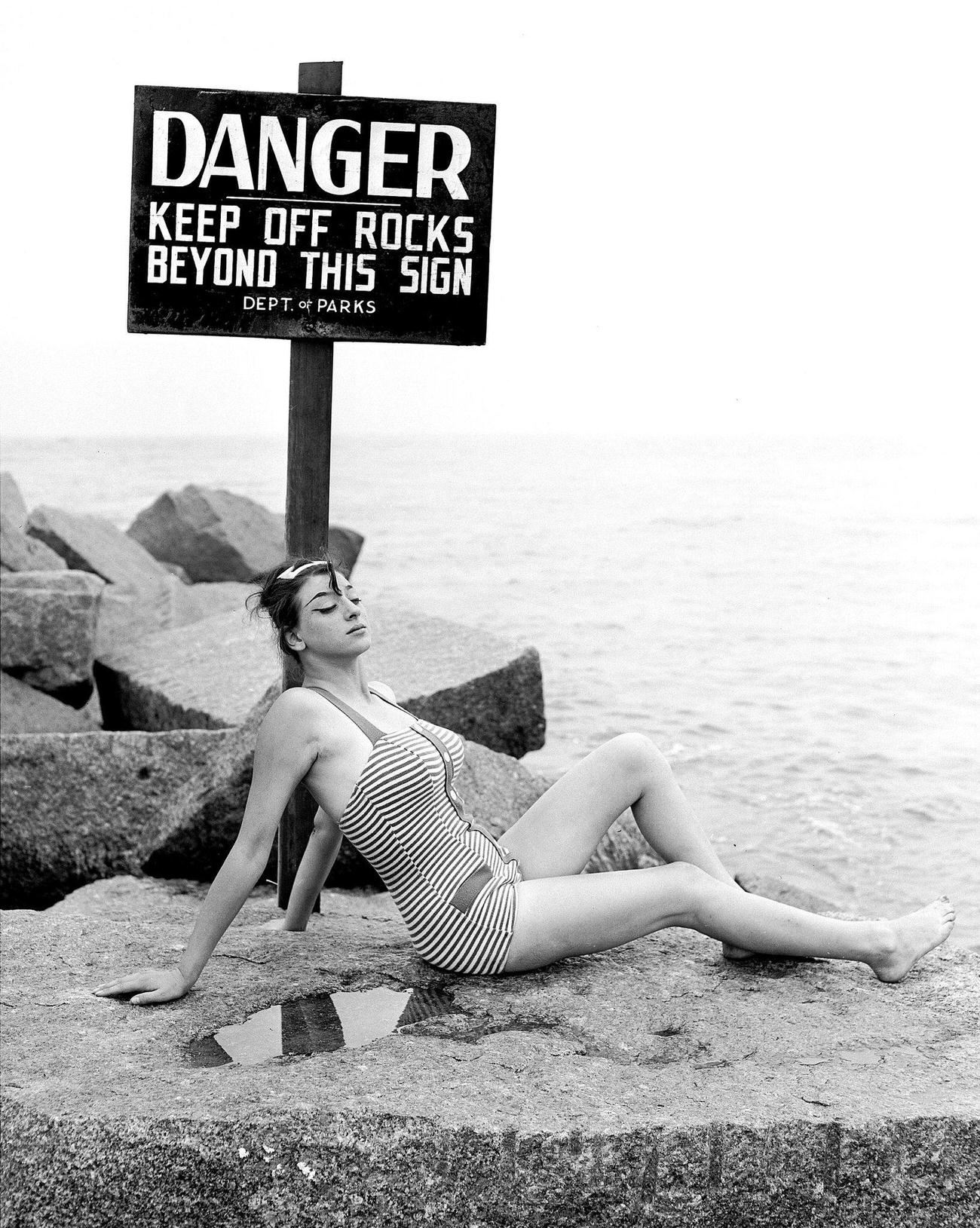 Marsha Diamond Basking In Solitude Under A Sign At Coney Island