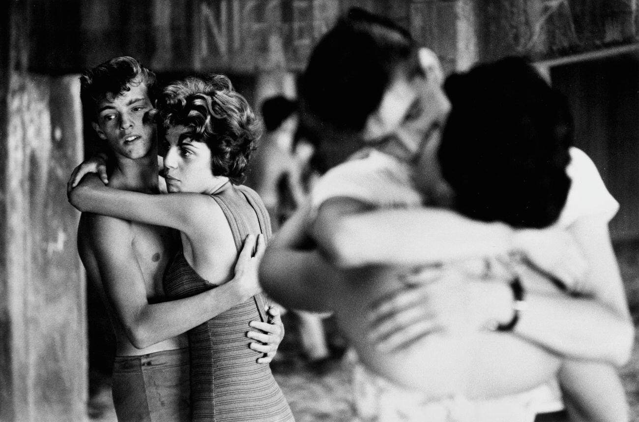 Couples Embracing Under Coney Island Boardwalk, 1961