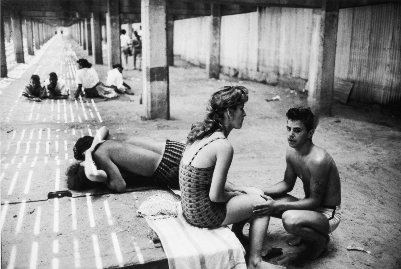 People Socializing Under Coney Island Boardwalk, 1961