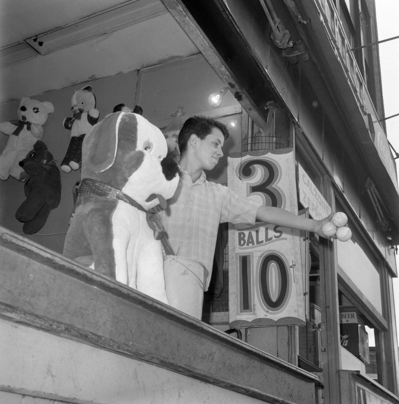Boy Trying His Luck At A Game In Coney Island