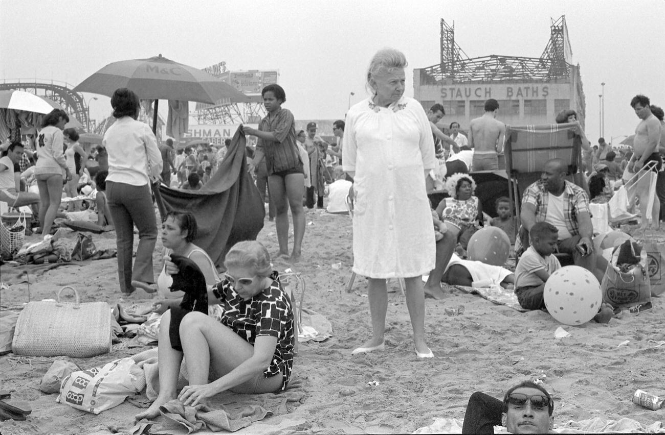 Elderly Woman Amidst Beachgoers At Coney Island, 1968