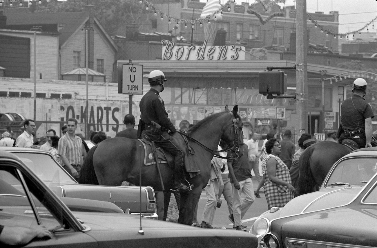 Mounted Police Patrol Crowded Street At Coney Island, 1968