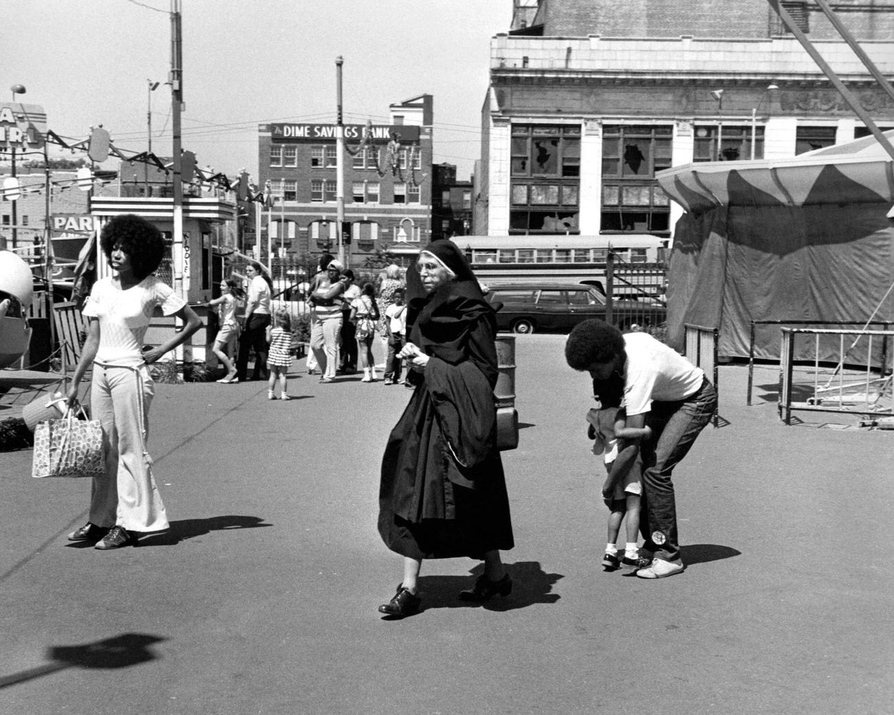 Nun Walking At Coney Island Amusement Park, 1973