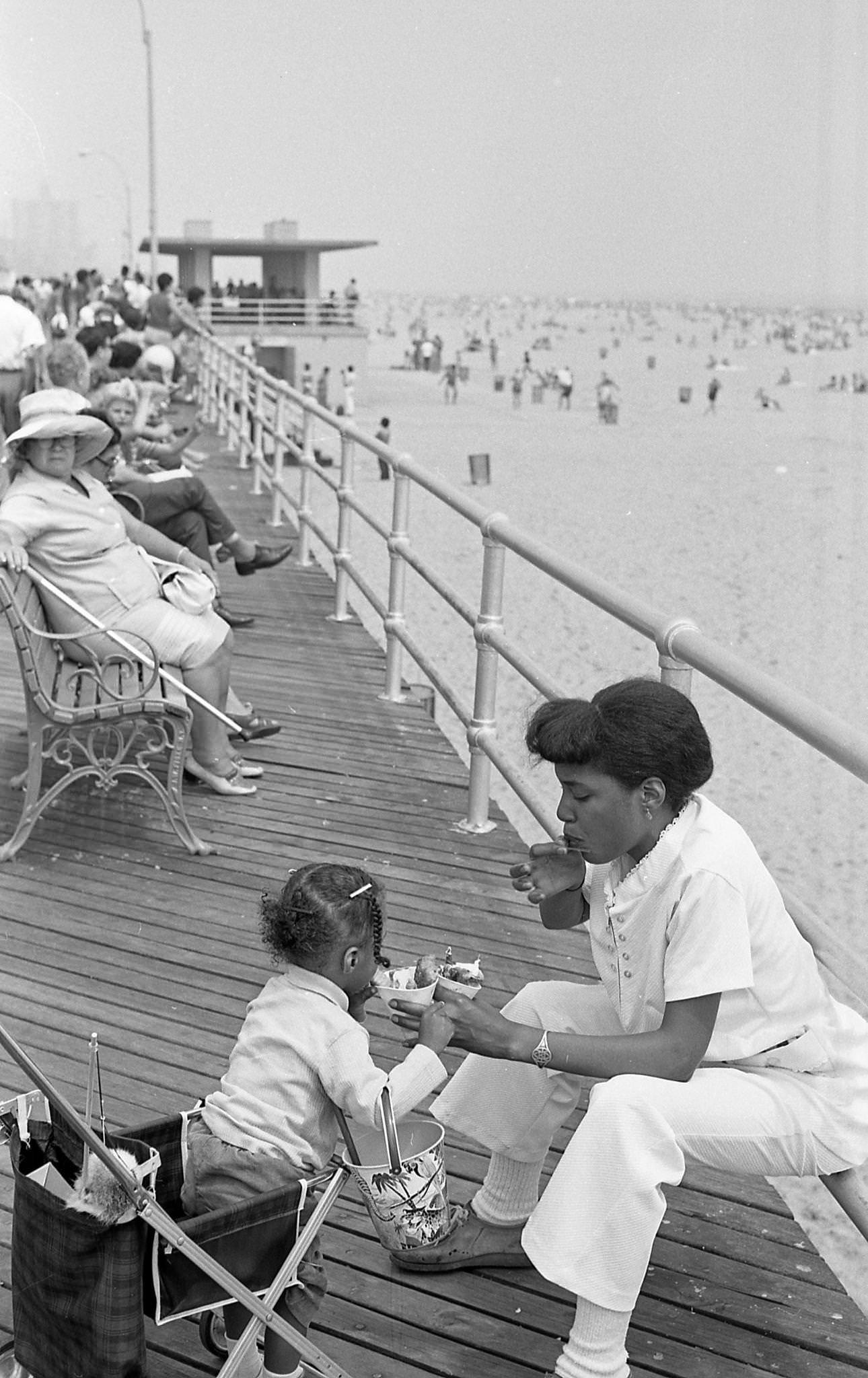 Woman Feeding Ice Cream To Baby On Coney Island Boardwalk, 1973
