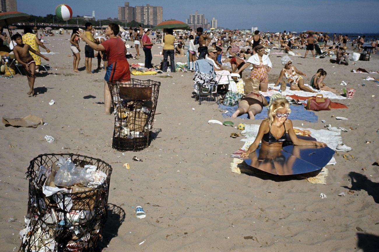 People On Coney Island Beach With A Woman Using A Reflector, 1971