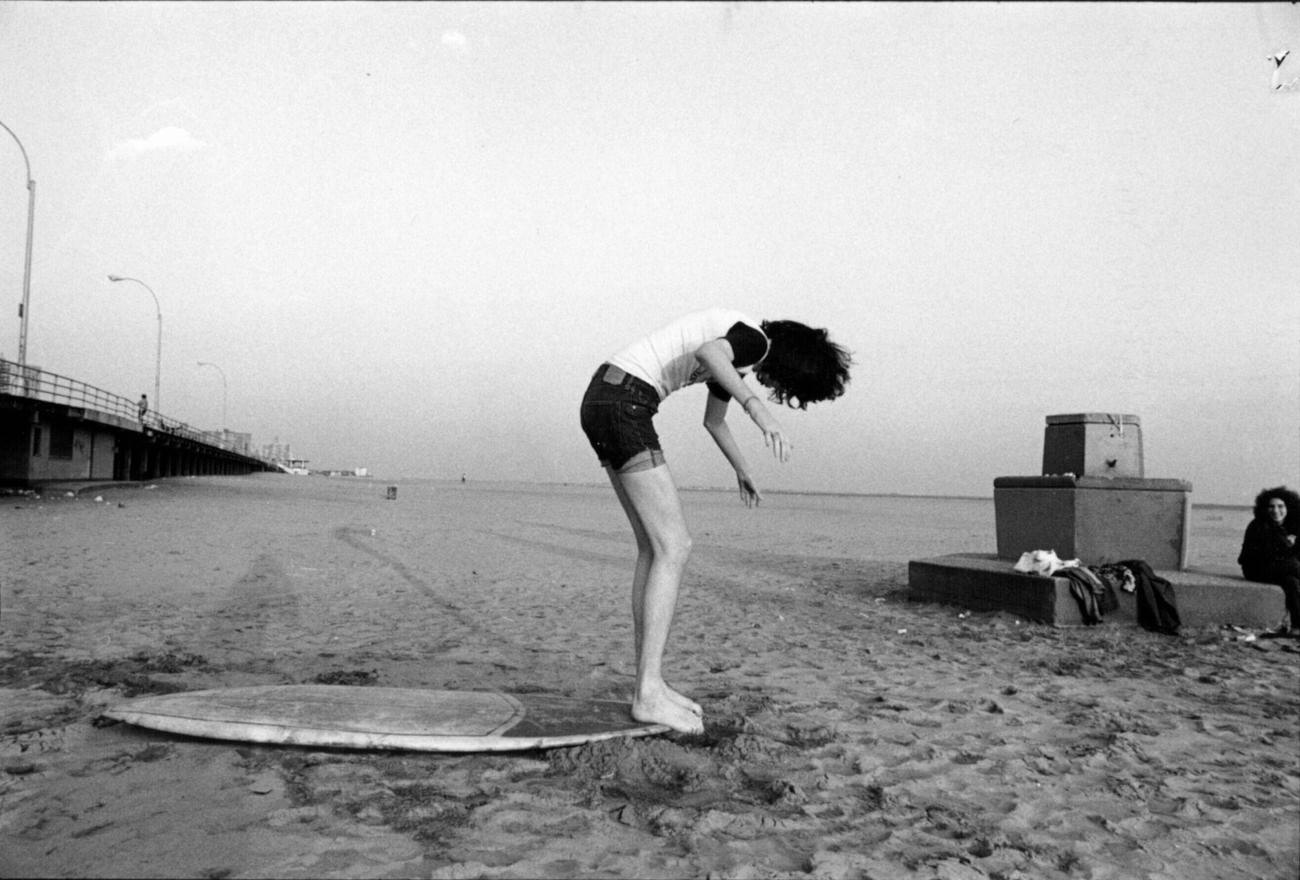 Joey Ramone On Surf Board At Coney Island, January 1976