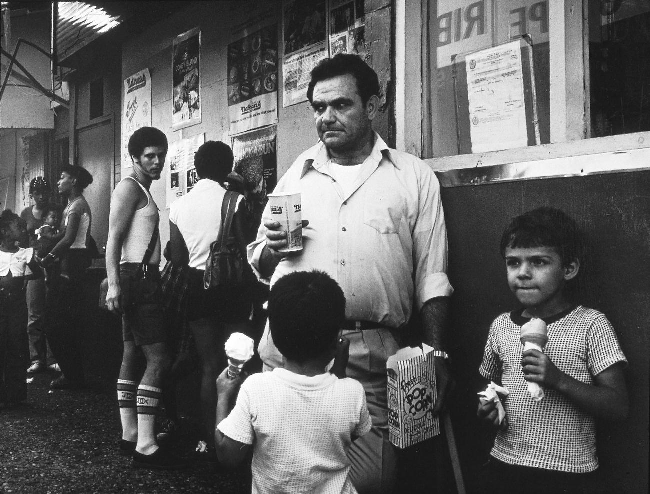 Man And Boys Enjoying Ice Cream And Popcorn At Coney Island, 1982