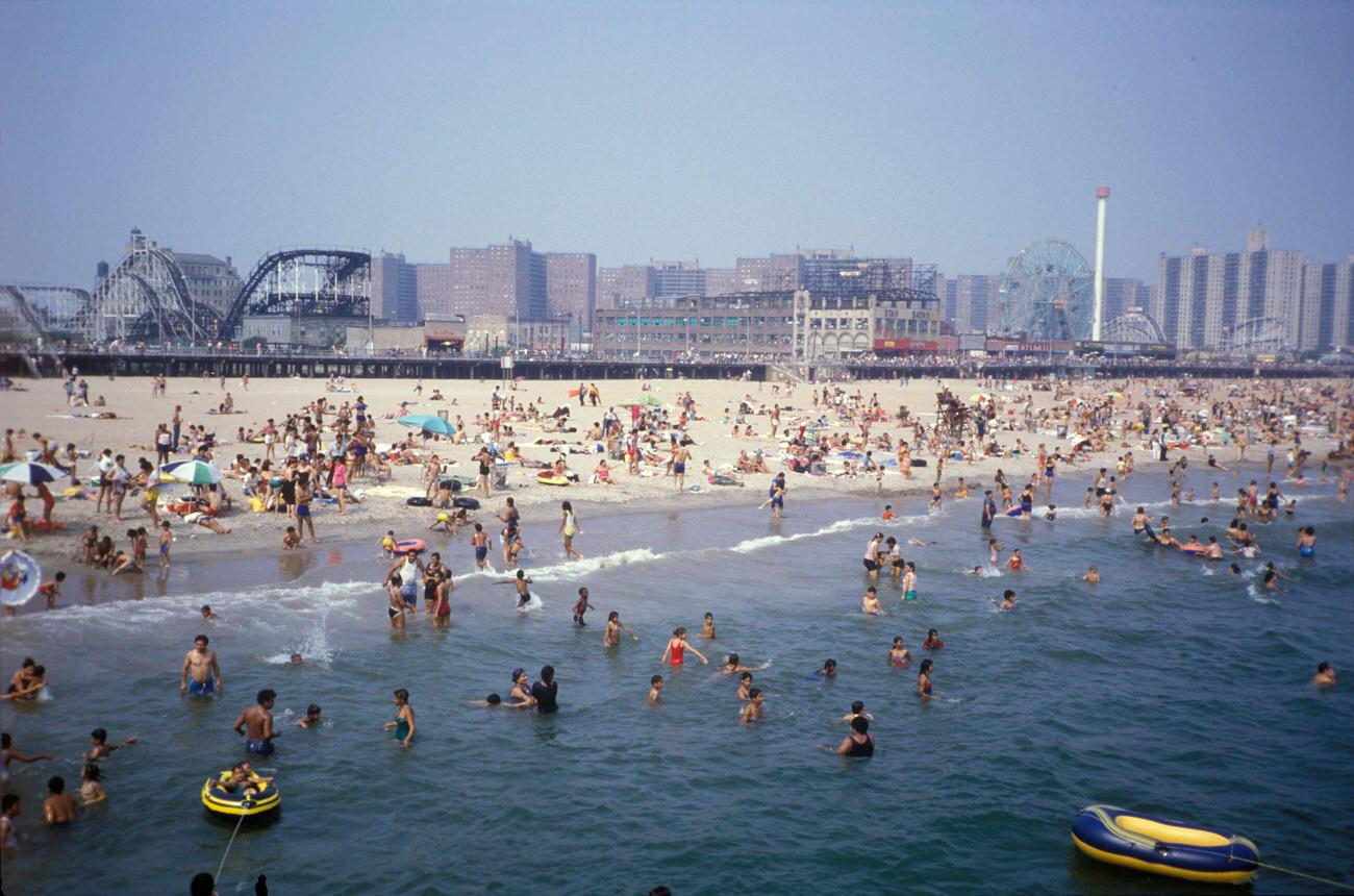 Crowds On Coney Island Beach With Amusement Parks In The Background, 1990S