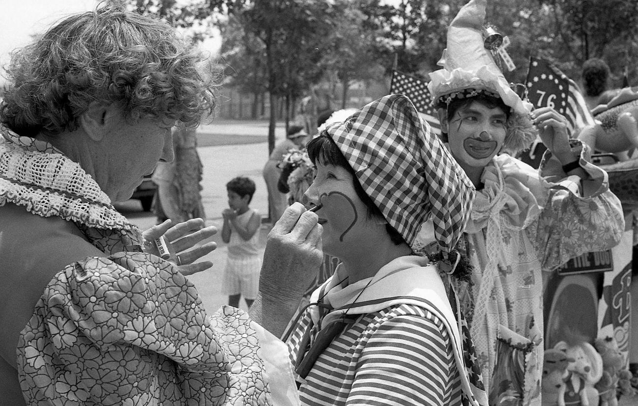 Makeup Being Applied To Street Performer In Clown Costume At Coney Island Mermaid Parade, 1989