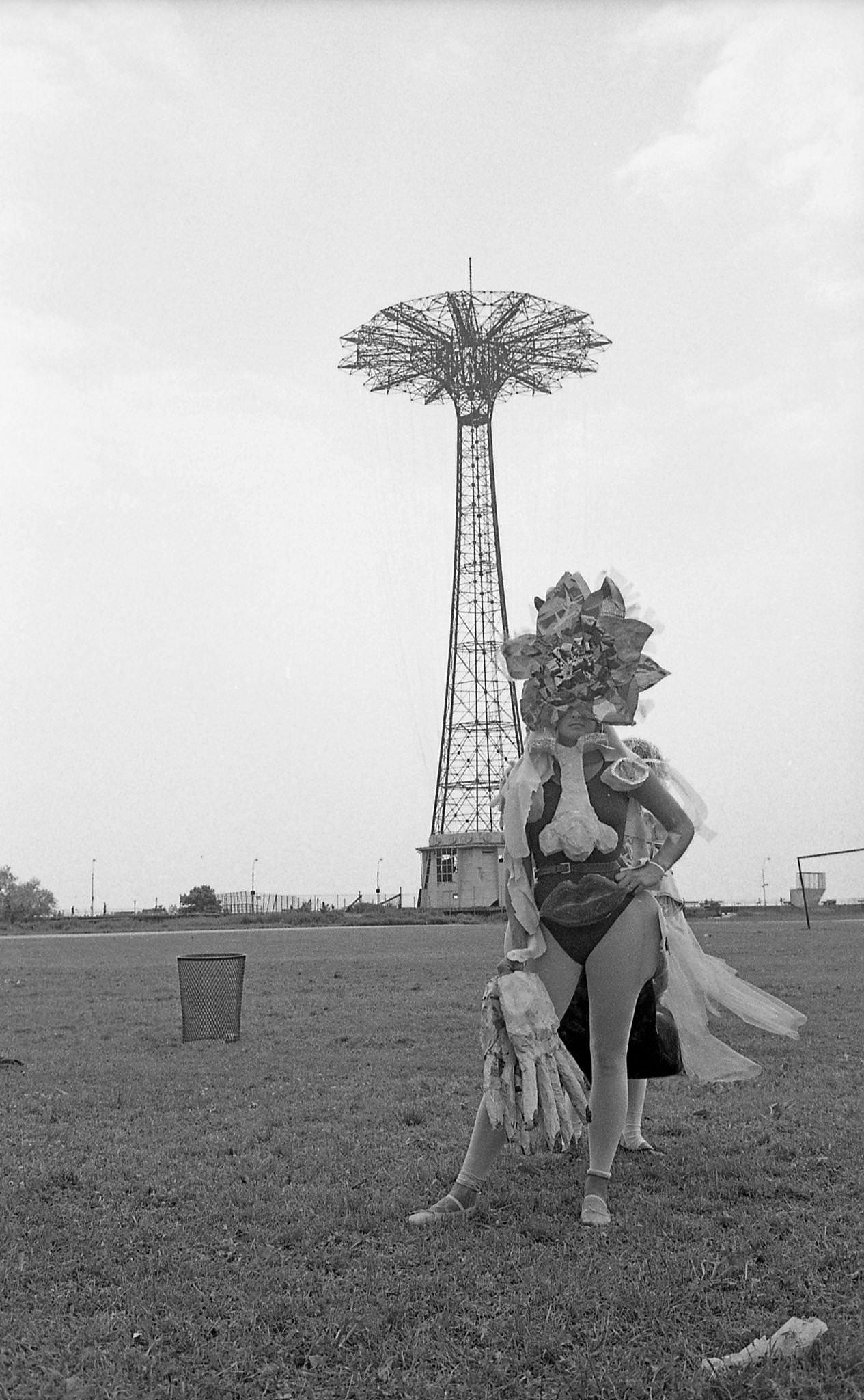 Woman In Mermaid Costume Poses In Front Of Parachute Jump At Coney Island Mermaid Parade, 1989