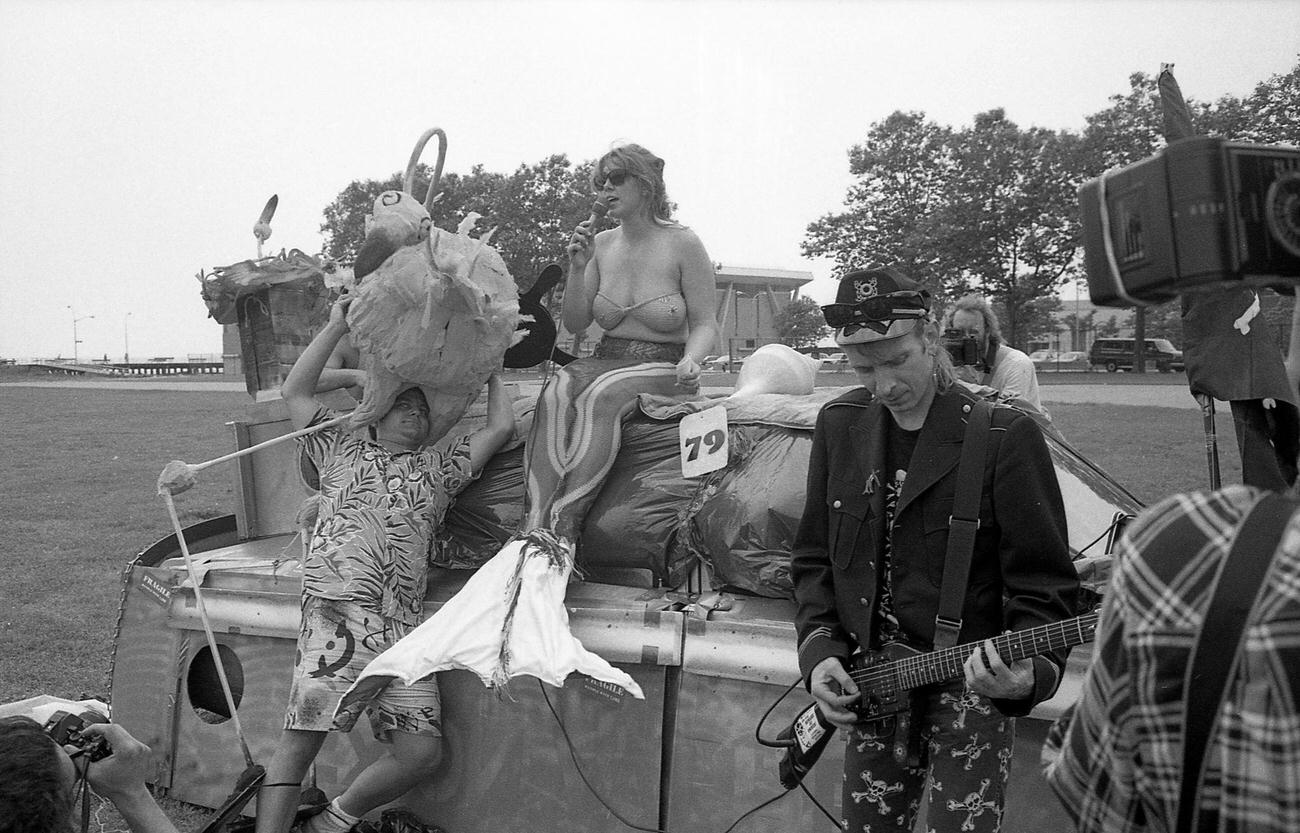 Singer In Mermaid Costume Performs With Electric Guitarist At Coney Island Mermaid Parade, 1989