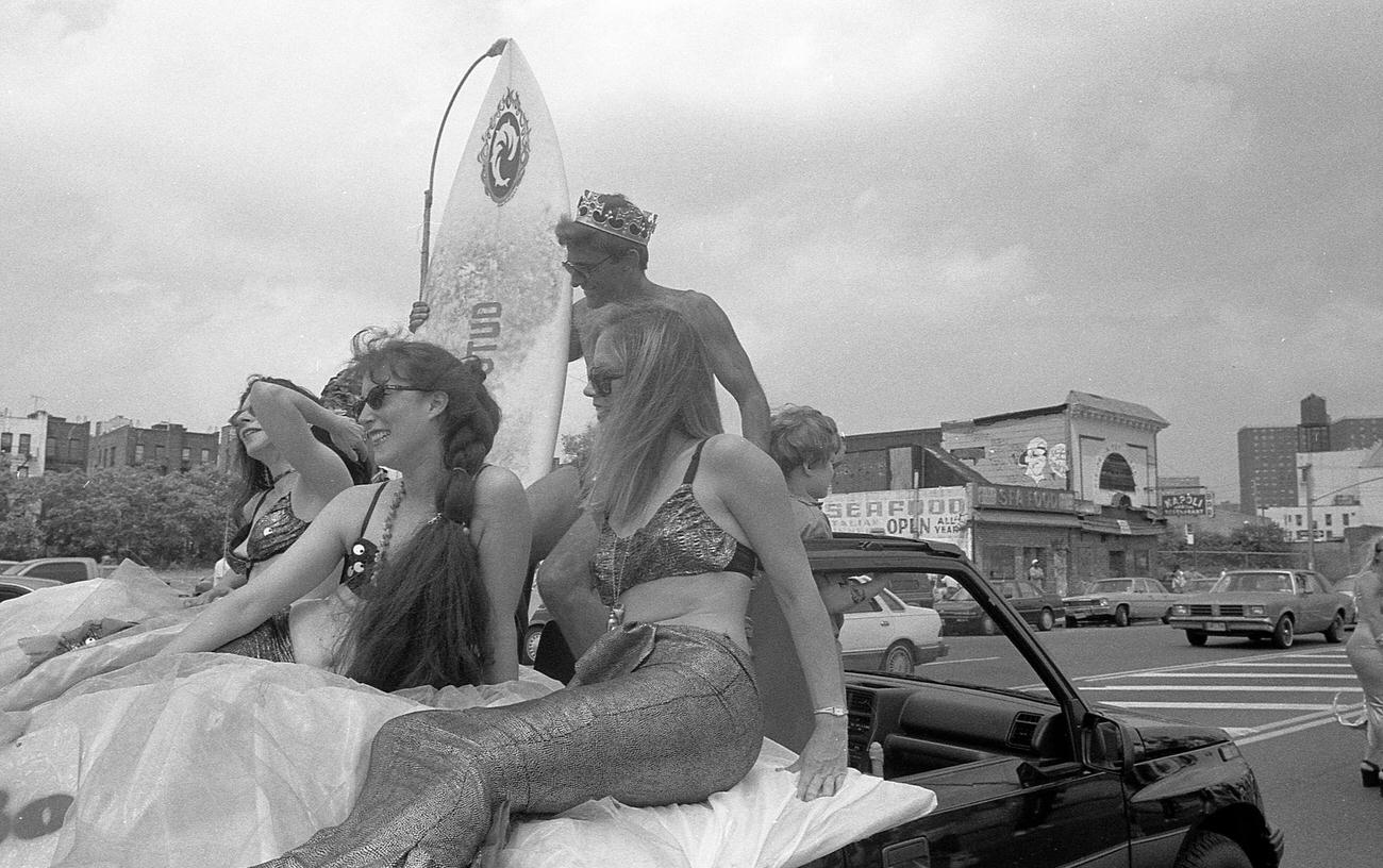 Mermaids And Surfer In The Coney Island Mermaid Parade, 1994