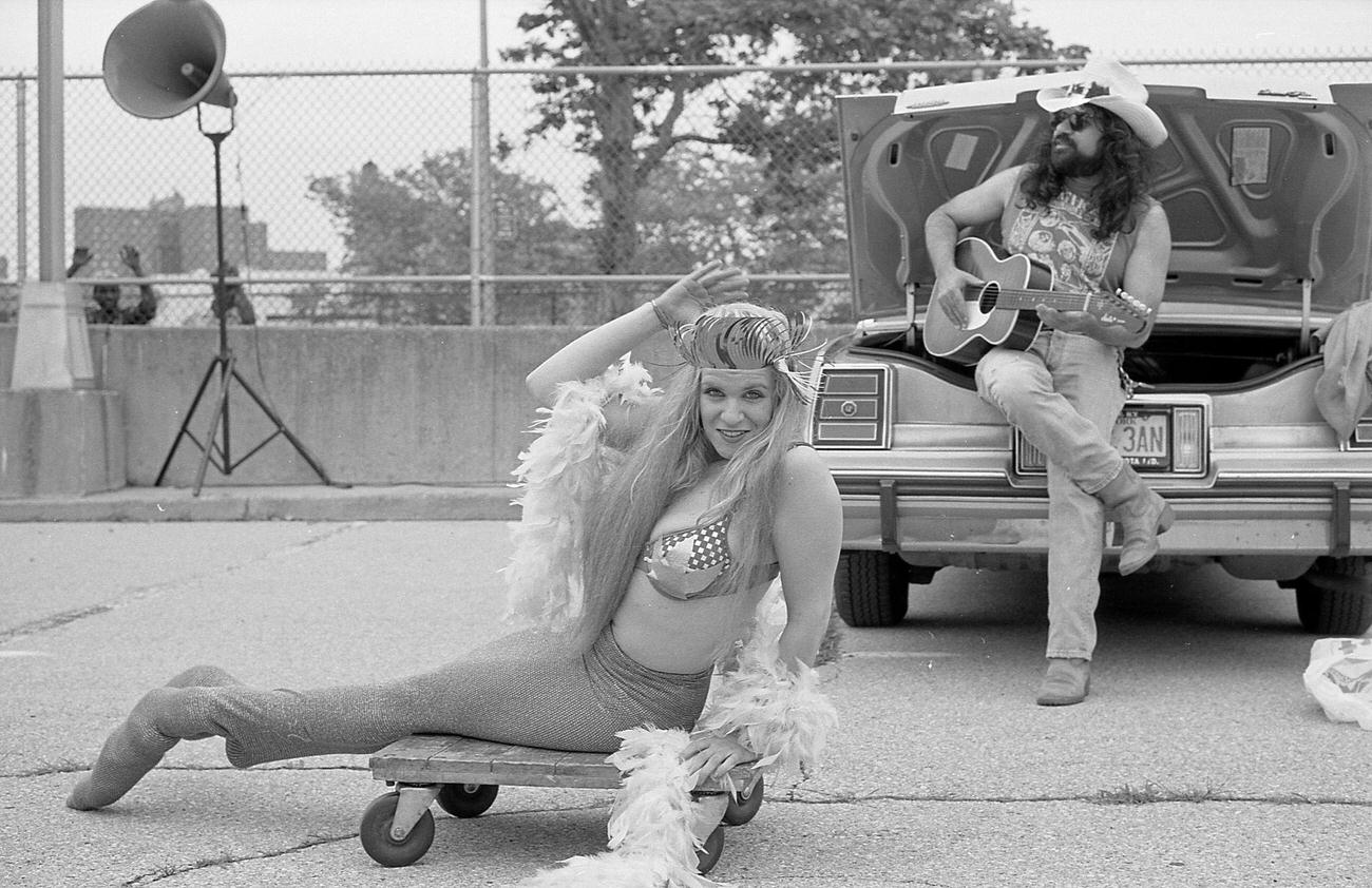 Woman In Mermaid Costume Poses With Cowboy Guitarist, 1995