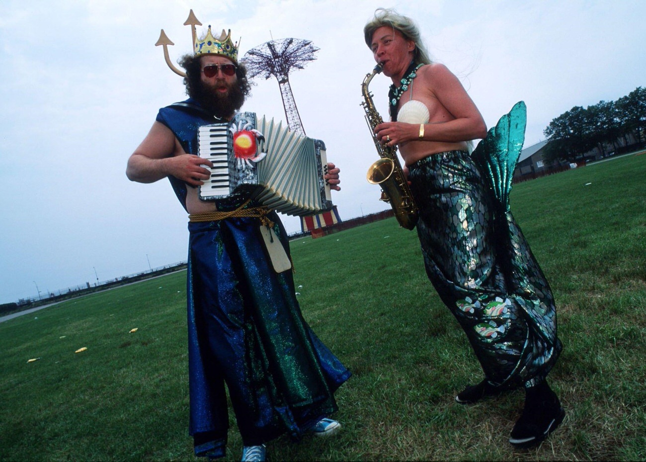 Mermaid And Merman Play Musical Instruments At Mermaid Parade, 1996