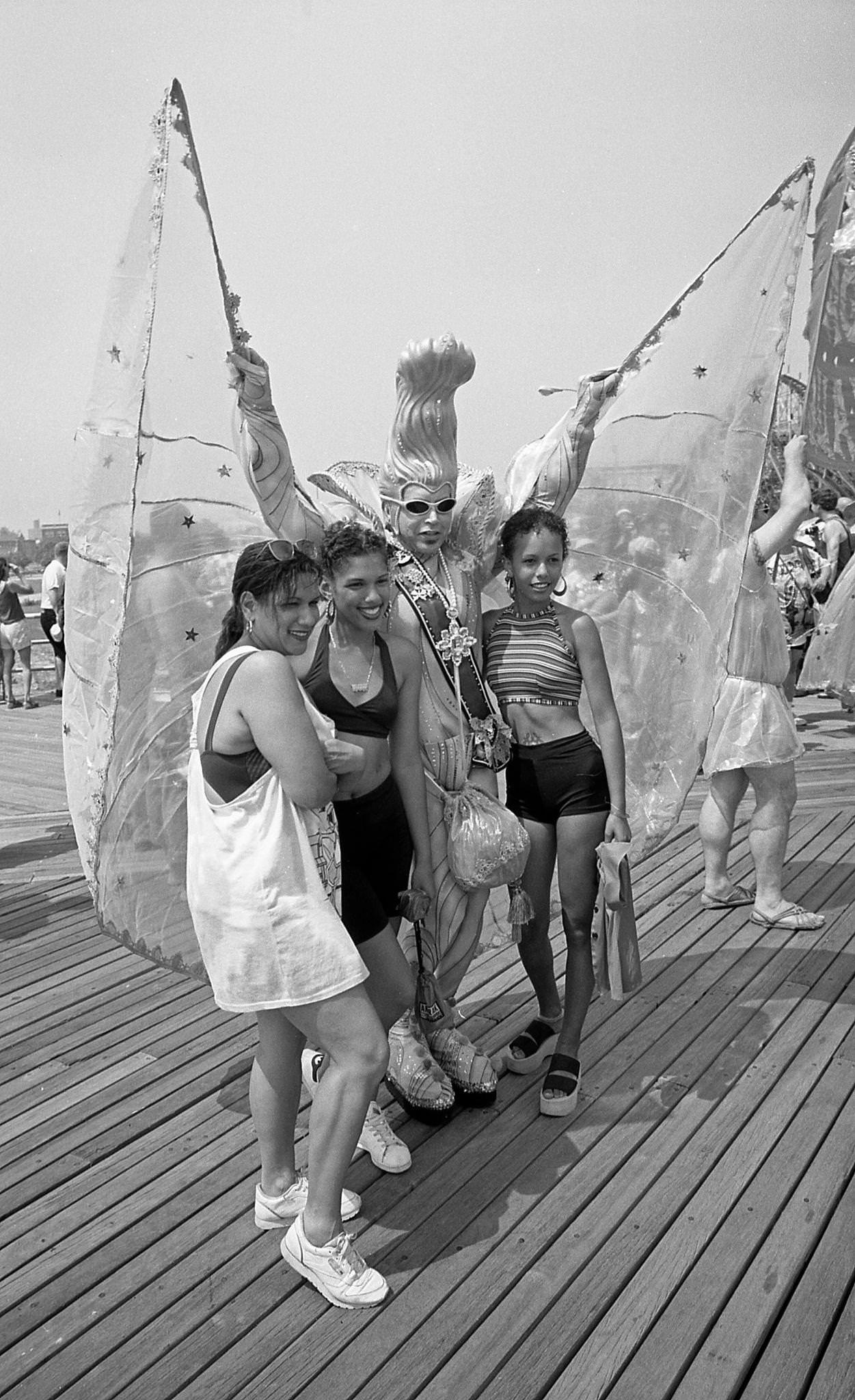 Women Pose With Man In Winged Costume At Coney Island Mermaid Parade, 1997