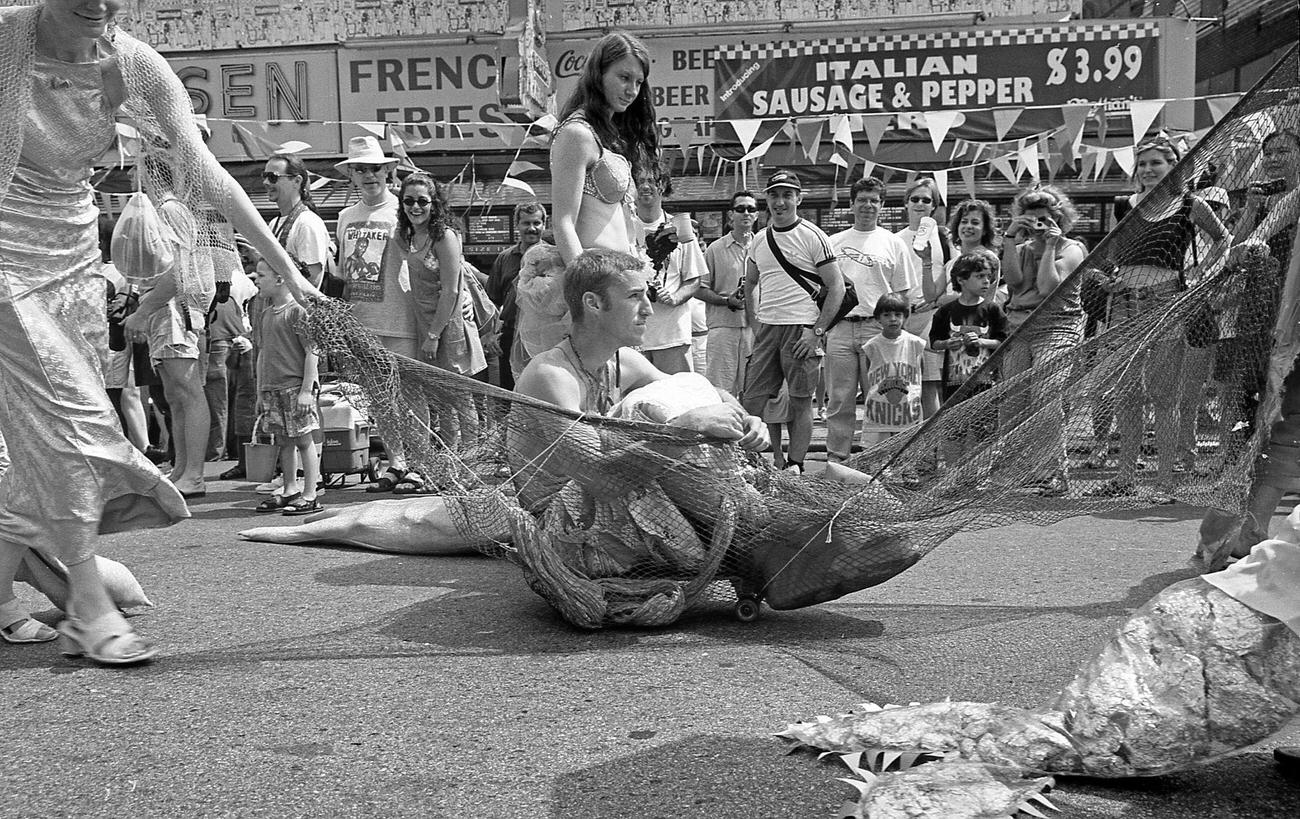 Women Pull Man Wrapped In Net At Coney Island Mermaid Parade, 1997