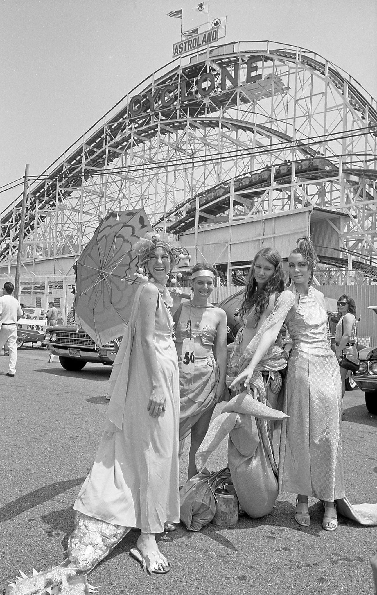 Women Pose In Front Of Cyclone Roller Coaster At Coney Island Mermaid Parade, 1997