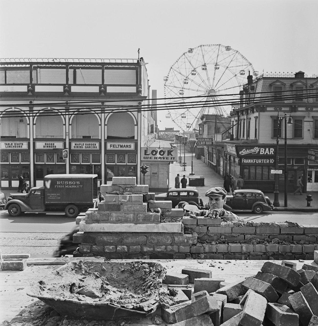 Bricklayer Building Wall With Wonder Wheel In Background At Coney Island, 1950