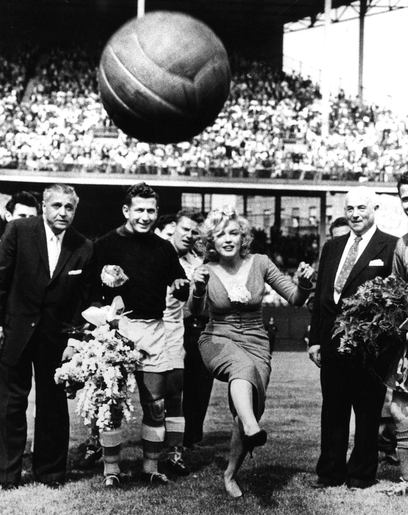 Marilyn Monroe And Israeli Goalkeeper Kick Soccer Ball At Ebbets Field, 1957