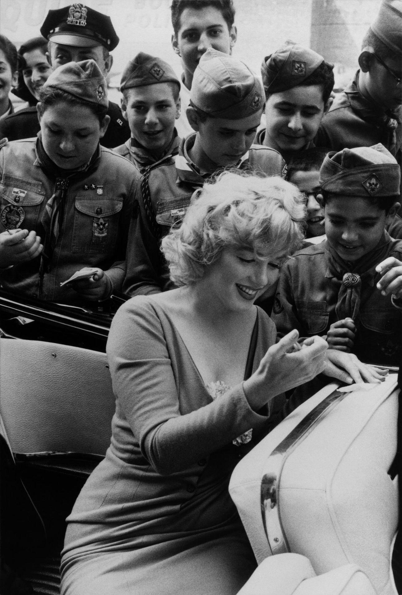 Marilyn Monroe Signs Autograph During Soccer Kick-Off At Ebbets Field, 1957