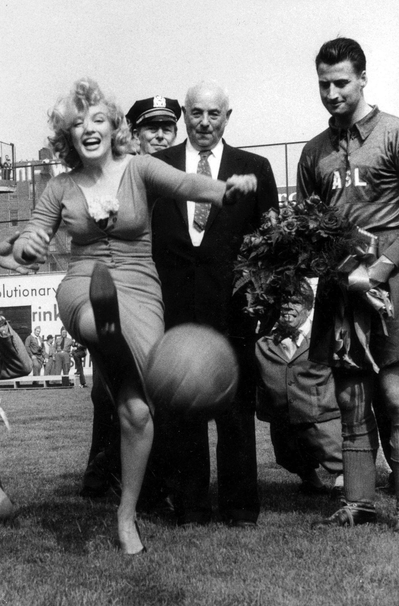 Marilyn Monroe Kicks Soccer Ball During Ceremony At Ebbets Field, 1957