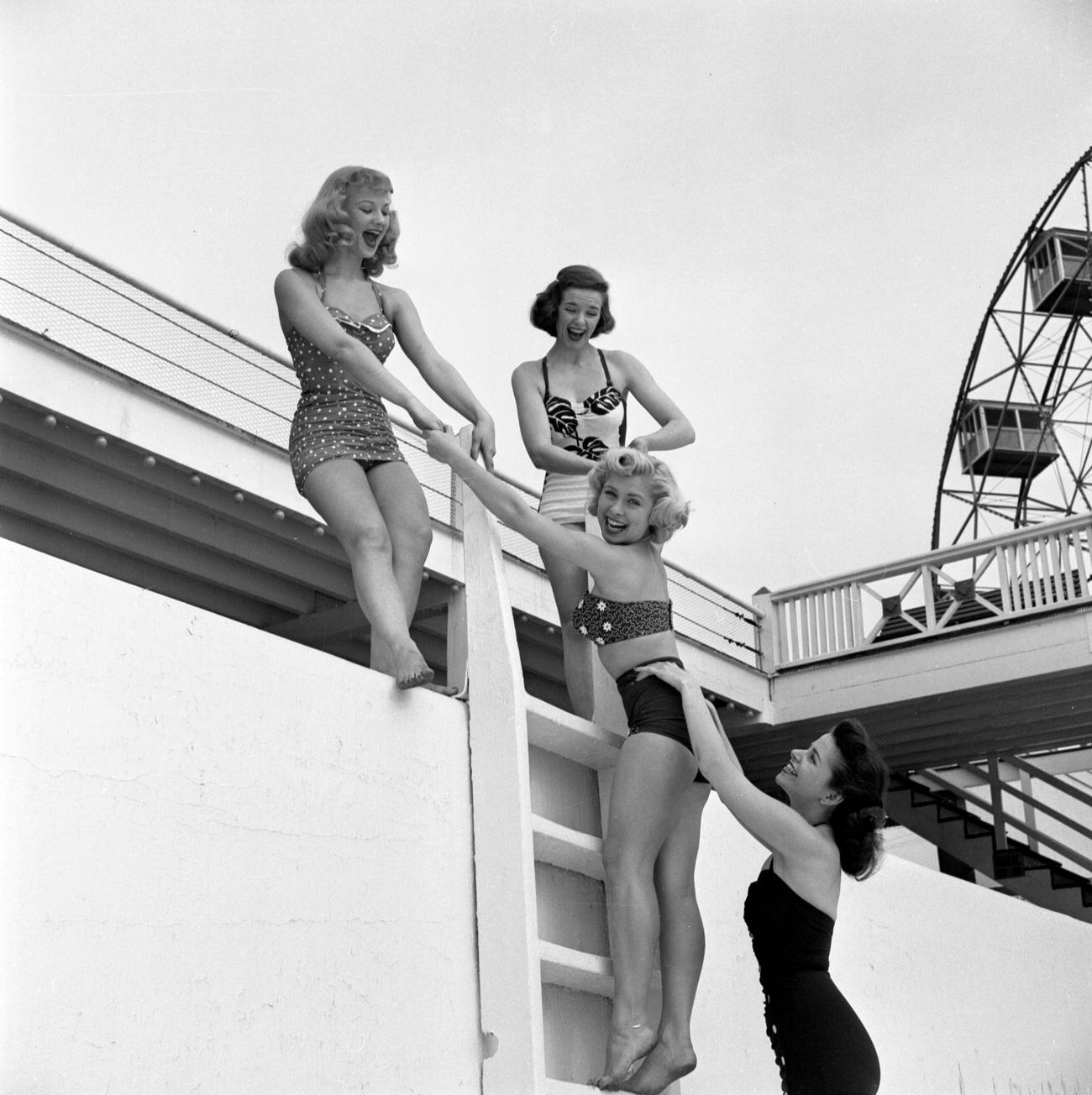 Cbs Models Climbing A Ladder At The Steeplechase Park Pool, 1953.