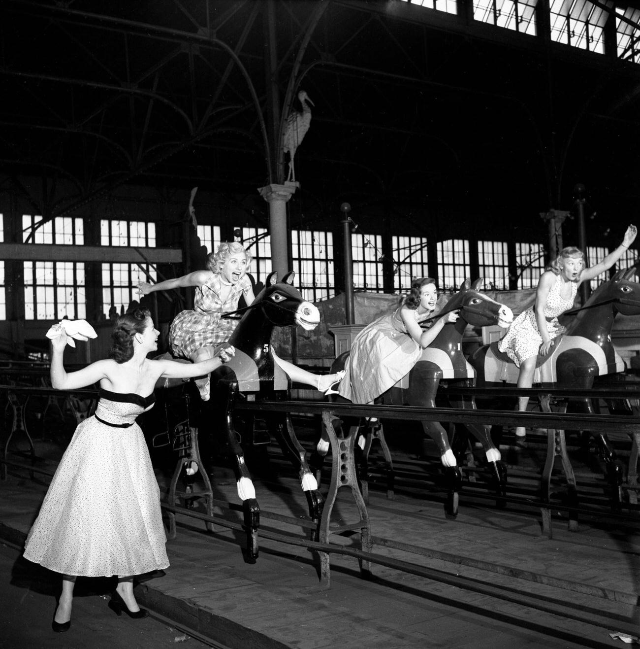 Cbs Models Watch As Others Ride The Steeplechase Horse Ride At Steeplechase Park, 1953.