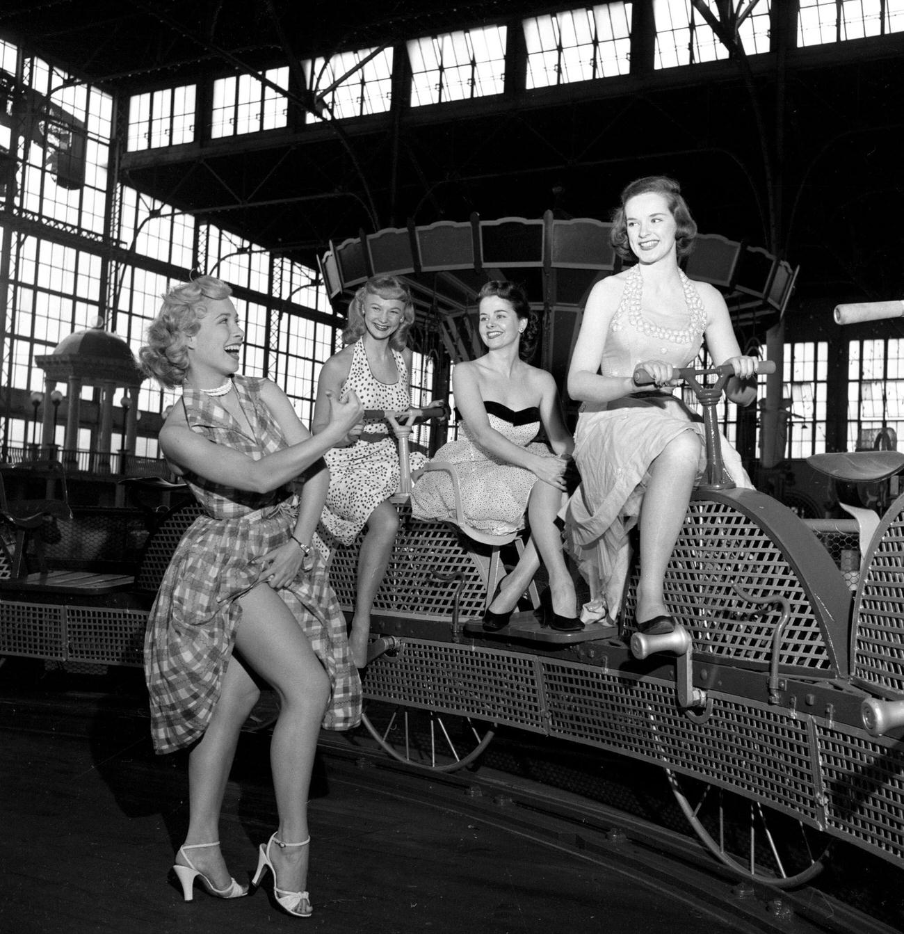 Cbs Models Ride The Bicycle Carousel Inside The Pavilion At Steeplechase Park, 1953.