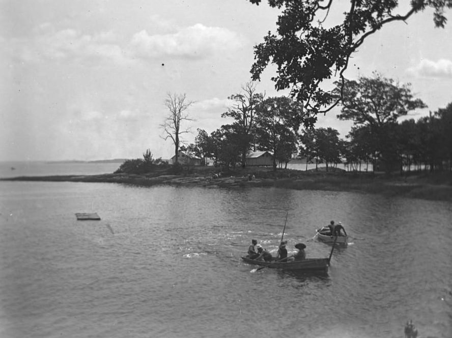 Boats In An Inlet, With Tents Beyond, Orchard Beach, Bronx, 1910.